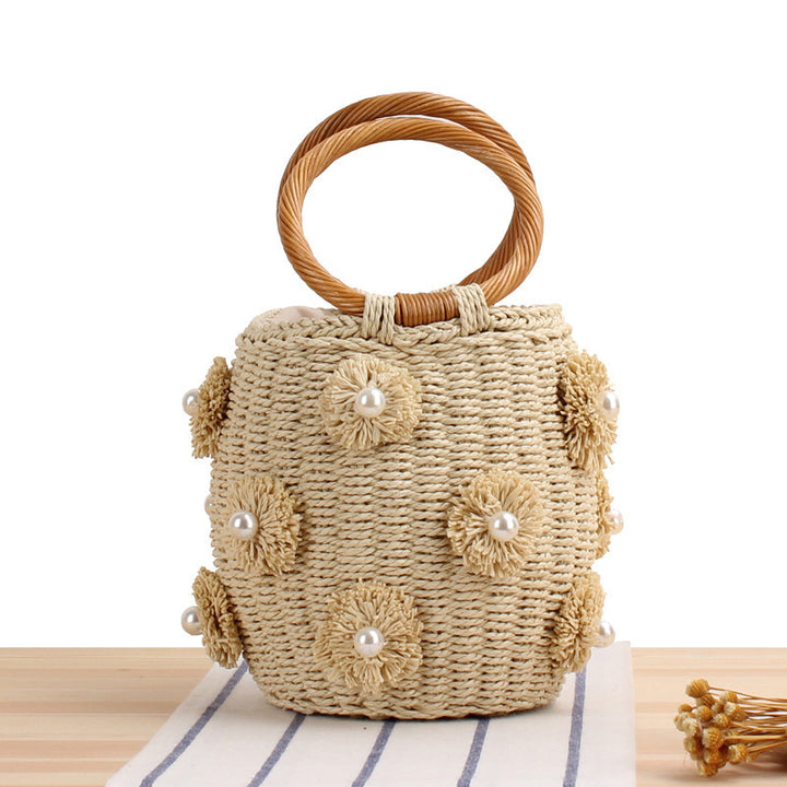 Handcrafted basket bag with bead appliqués Bowlift
