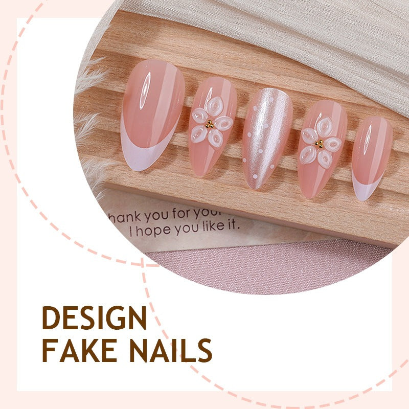 Artificial nail set with elegant French tips and delicate floral accents Bowlift