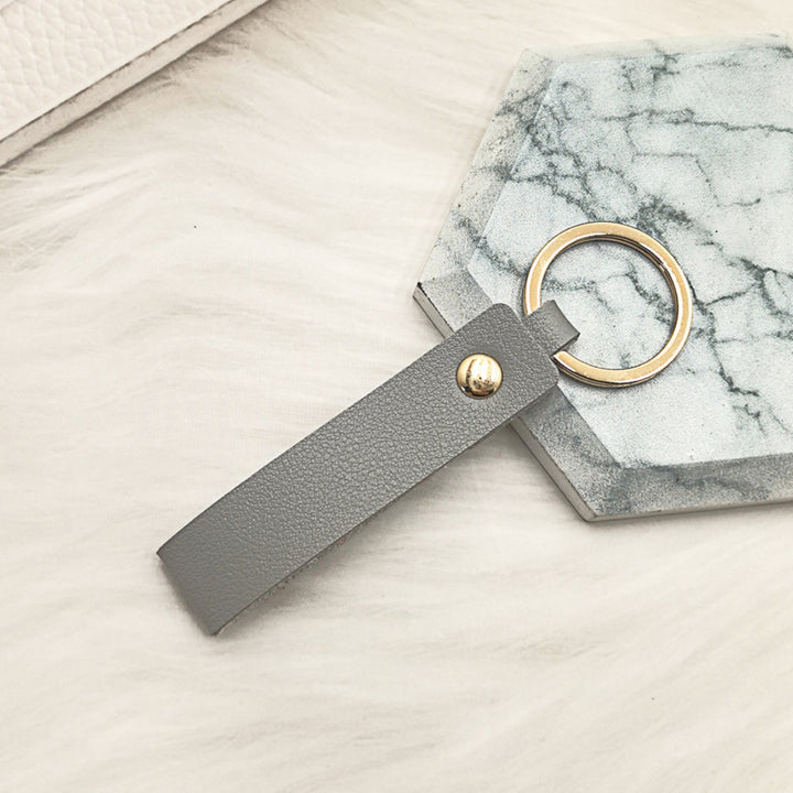 Unisex keychain made of high-quality synthetic leather with elegant metal embellishment Bowlift