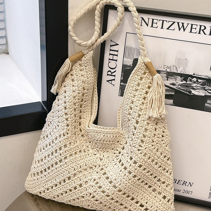 Hand-knotted shoulder bag with tassels and spacious interior Bowlift