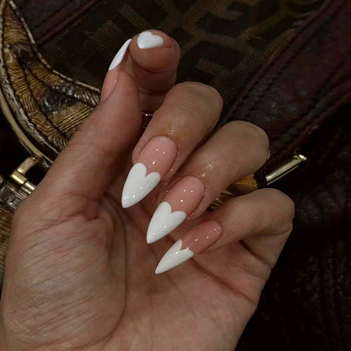 Elegant stiletto artificial nails with heart accents Bowlift