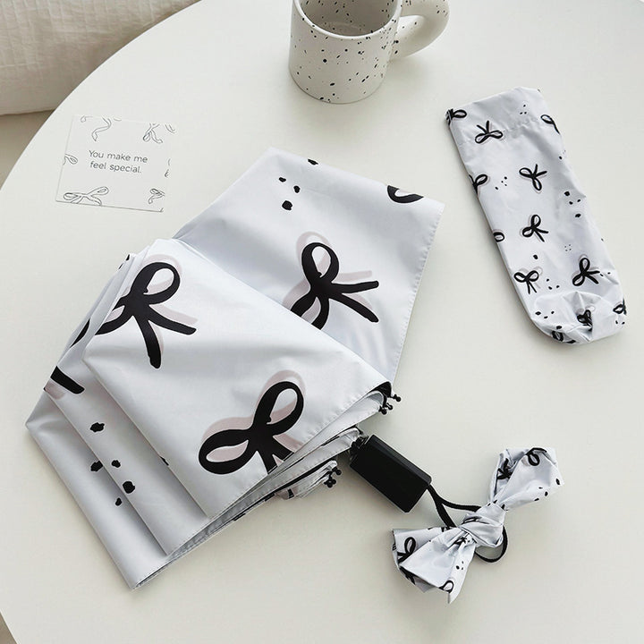 Women’s Folding Umbrella with Playful Bow Pattern Bowlift