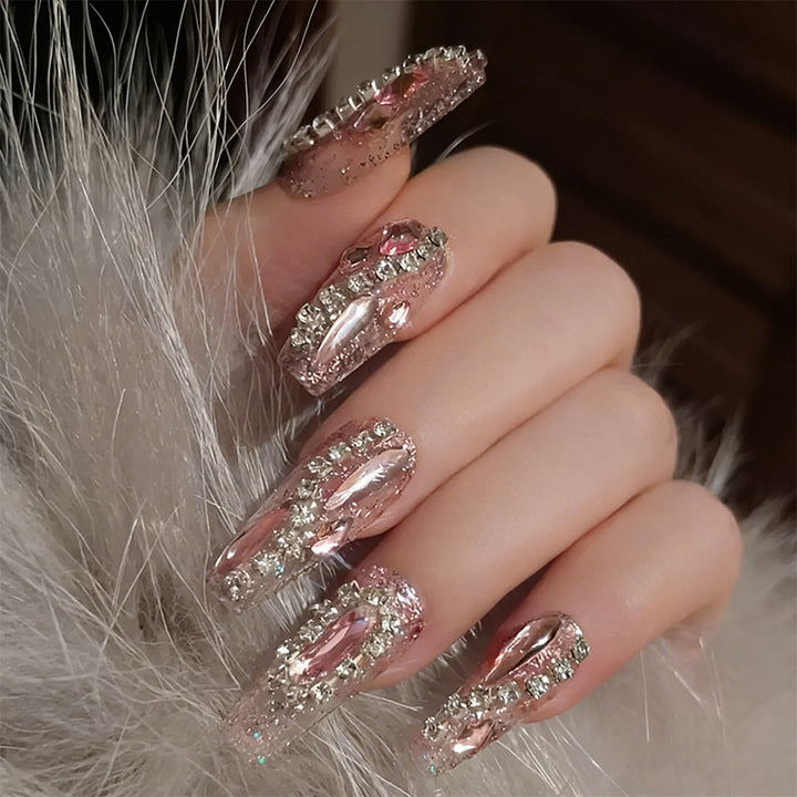 Glamorous artificial nails with sparkling rhinestone decorations Bowlift