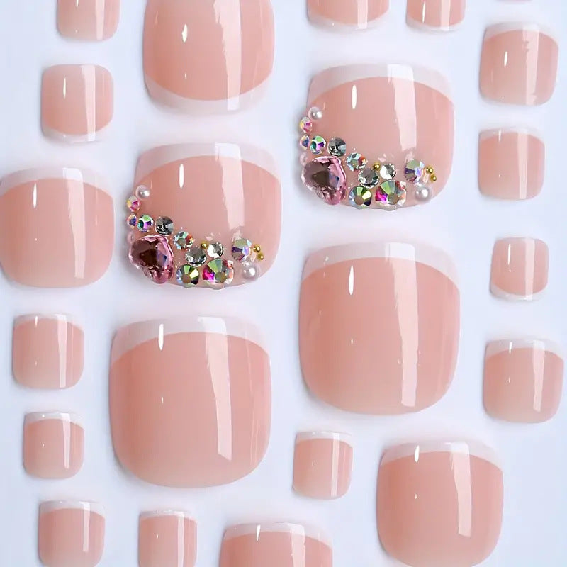 Artificial nail set with elegant French tips and glamorous crystal embellishments Bowlift