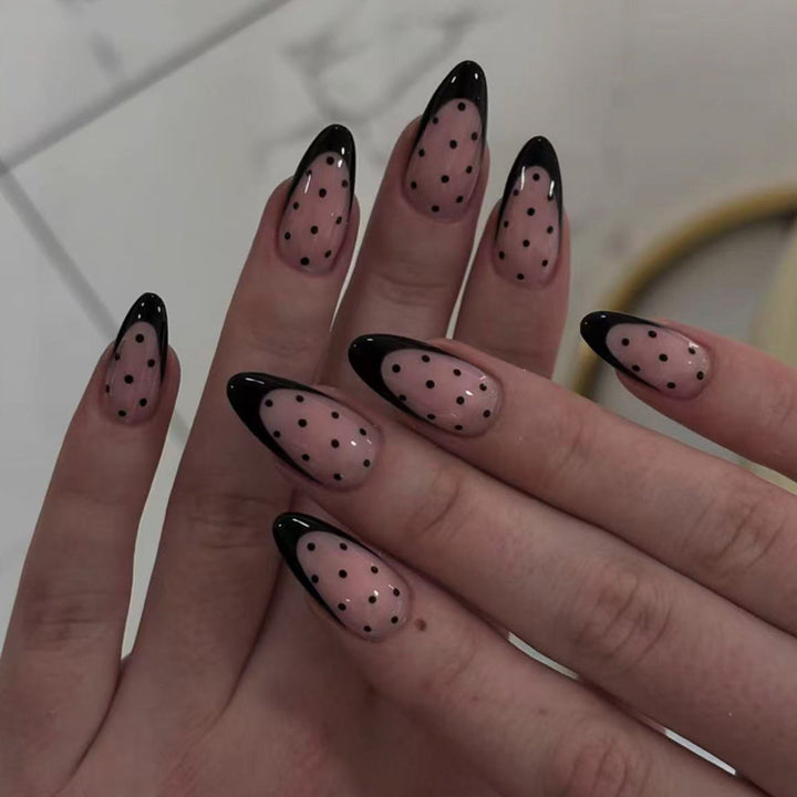 Artistic stiletto nails with black dot pattern Bowlift