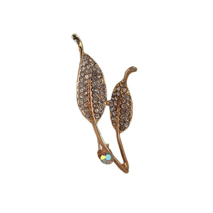 Elegant brooch with leaf shape and crystals Bowlift