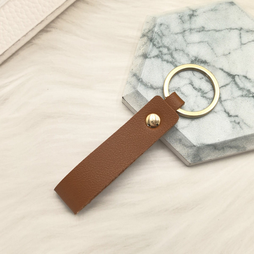 Unisex keychain made of high-quality synthetic leather with elegant metal embellishment Bowlift