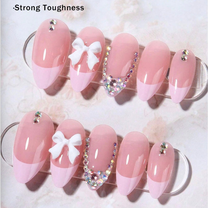 Acrylic nail set with elegant 3D bows and sparkling rhinestone embellishments Bowlift