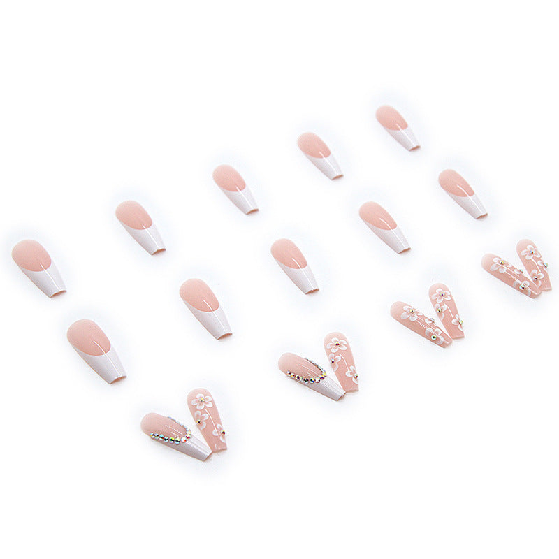 Artificial nail set with romantic floral decorations and glitter accents Bowlift