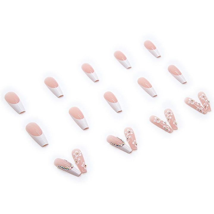 Artificial nail set with romantic floral decorations and glitter accents Bowlift