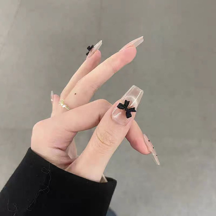 Artificial nails with playful bow design Bowlift