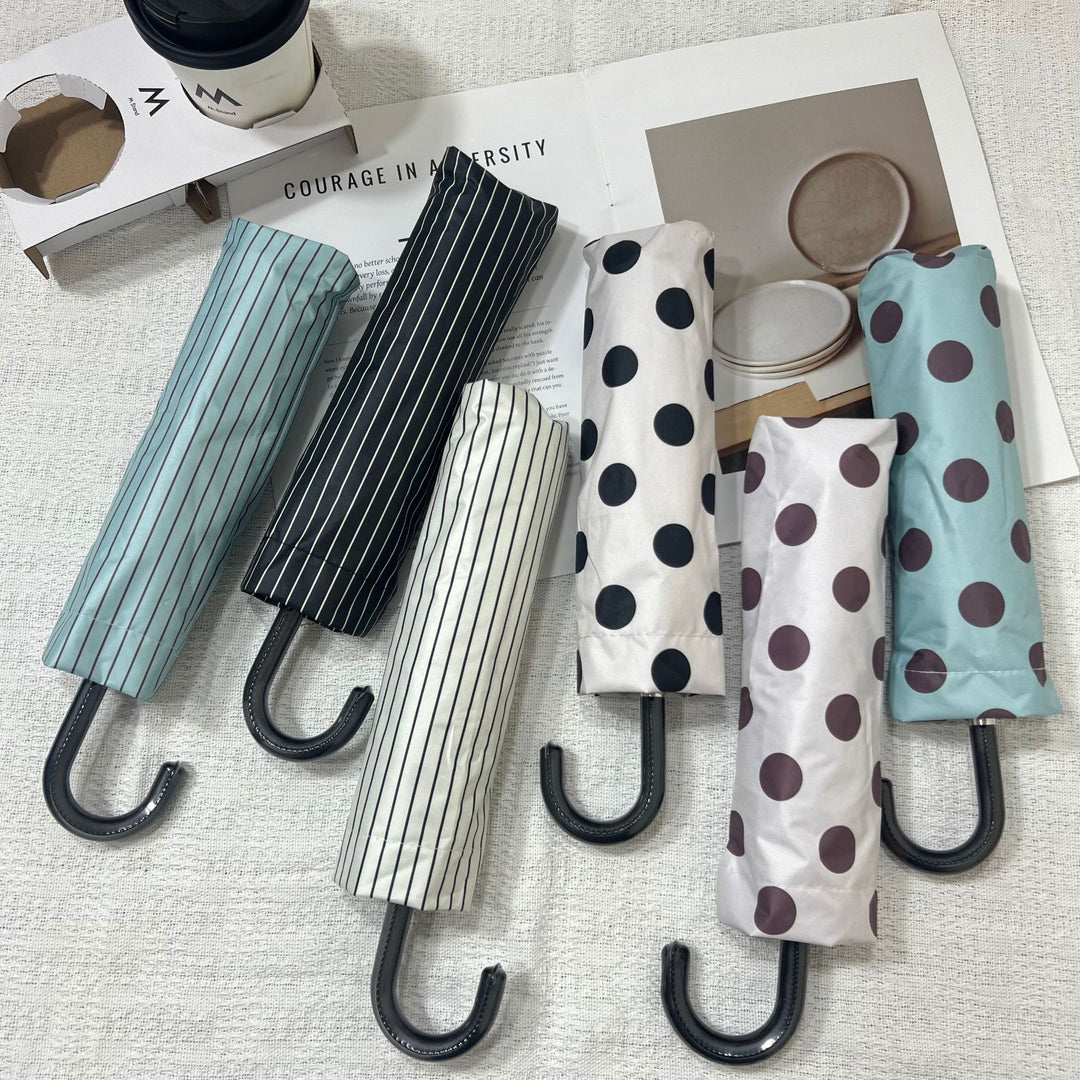 Women Folding Umbrella Bowlift