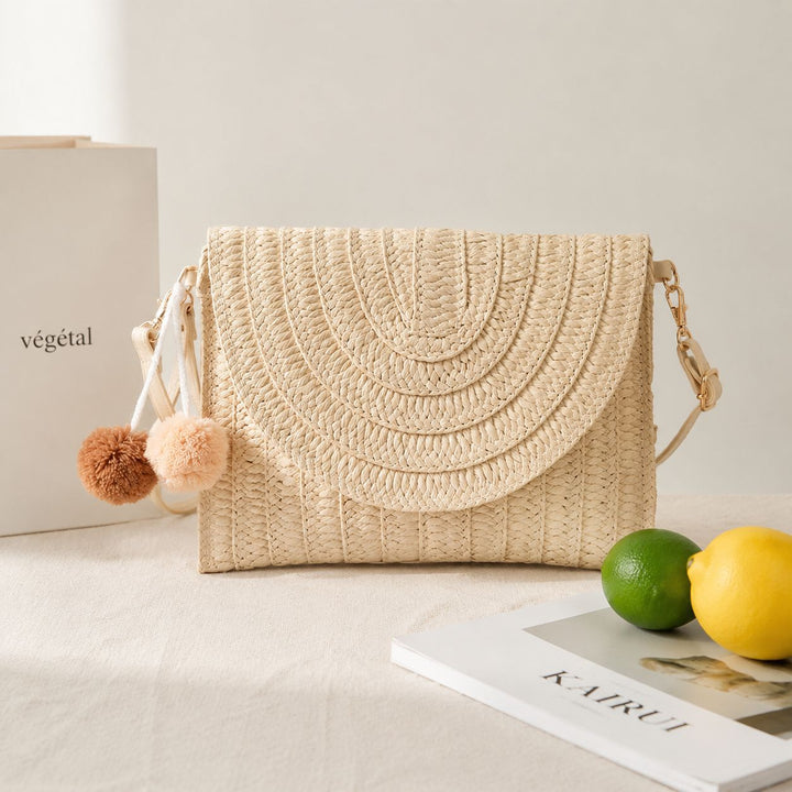 Braided shoulder bag with creative pom poms Bowlift