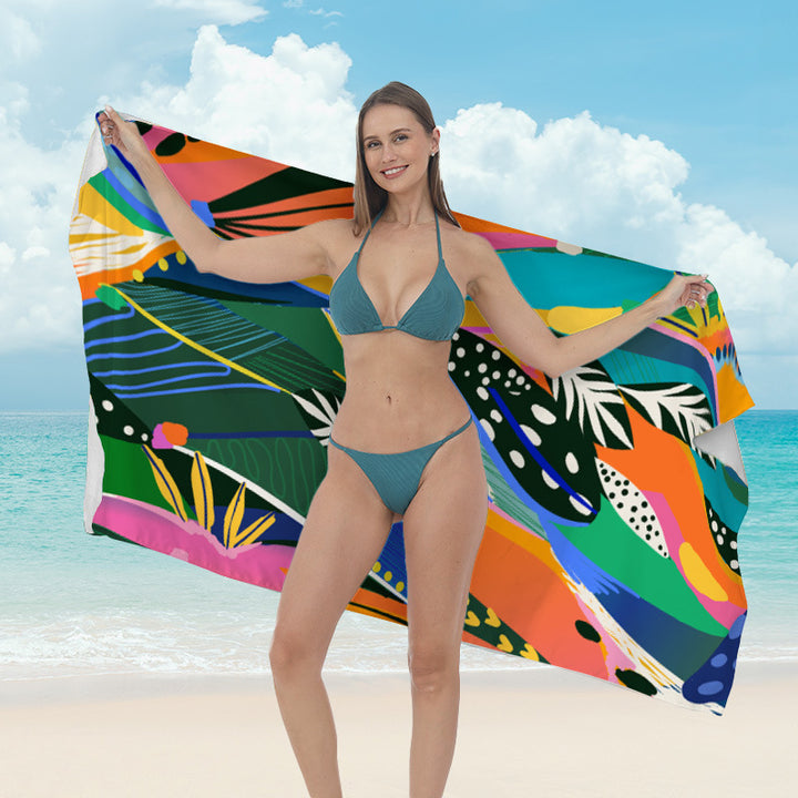 Beach towel with vibrant tropical plant motif Bowlift