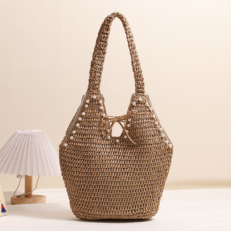 Handbag with pearl decor and innovative closure Bowlift