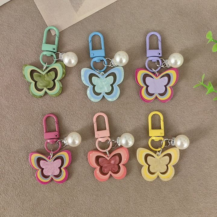 Keychain with butterfly and pearl accent Bowlift