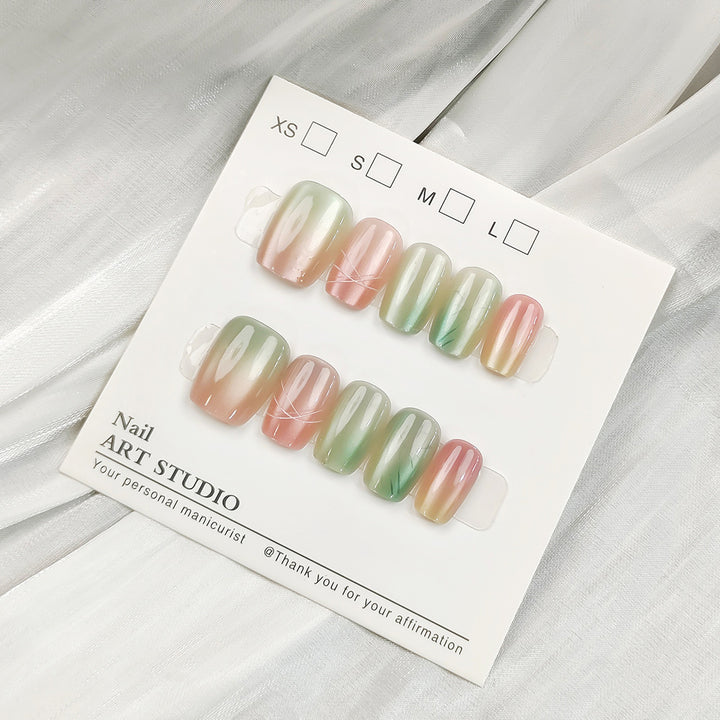 Artificial nail tips with shimmering design Bowlift