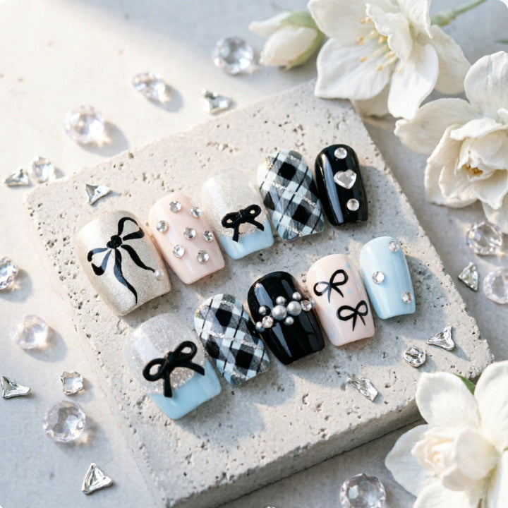 Artificial nails with elegant bows and rhinestones Bowlift