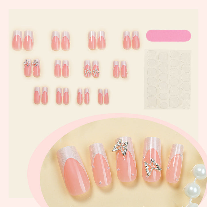 Nail art set with intricate designs and butterfly appliqués Bowlift
