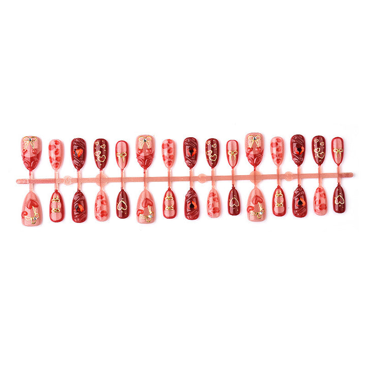 Festive artificial nails with romantic heart designs Bowlift