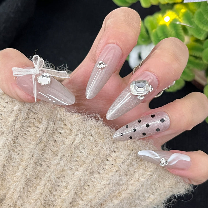 Glossy Nail Art Set with Sparkling Glitter Accents Bowlift