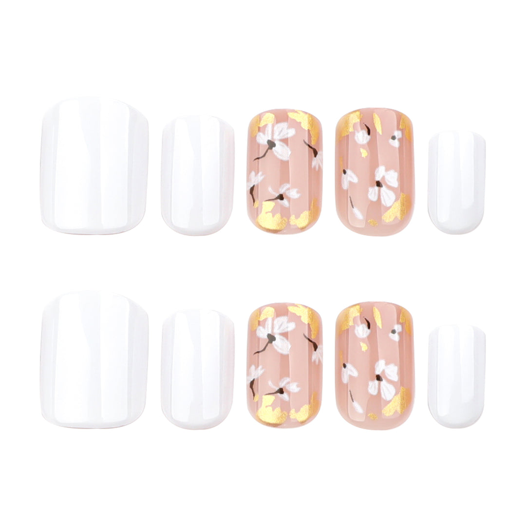 Artificial nail art with delicate flowers and glitter accents Bowlift