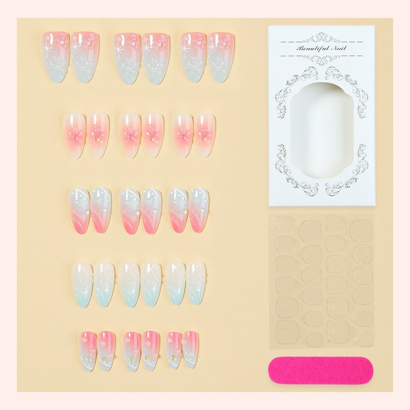Acrylic nail set with elegant ombre design and floral decorations Bowlift
