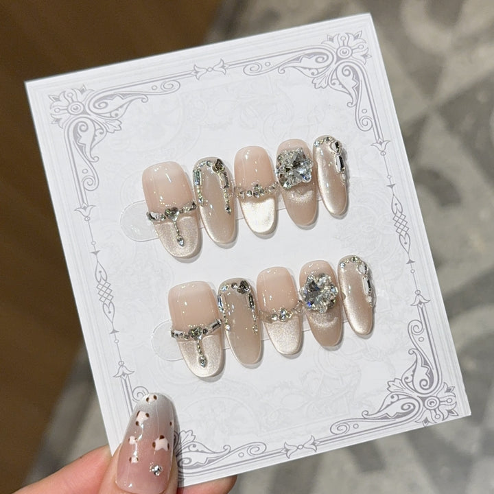 Glamorous nail tips with rhinestone and glitter effects Bowlift