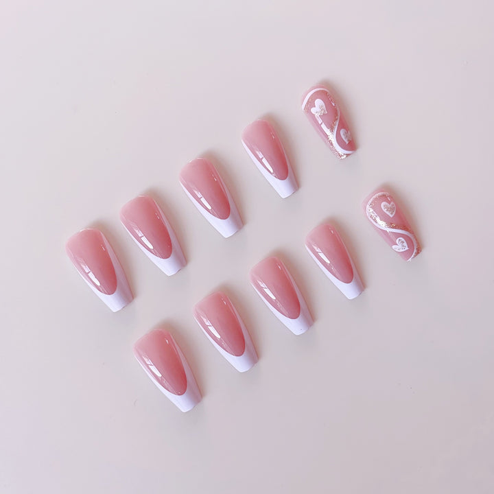Artificial nail set with elegant heart decorations and glitter accents Bowlift