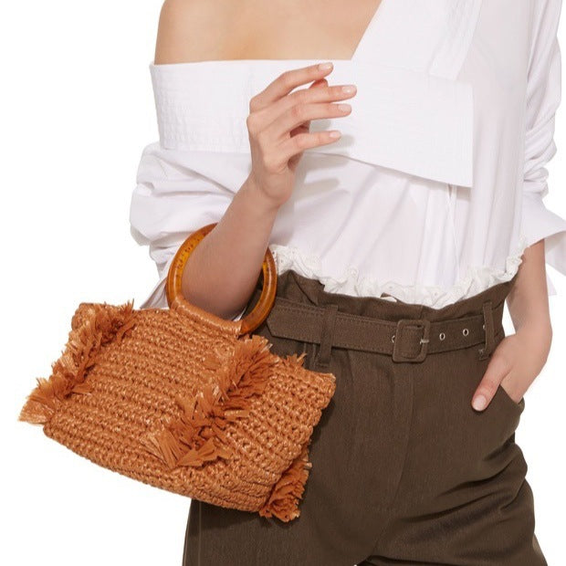 Handmade raffia shoulder bag with fringed accents Bowlift