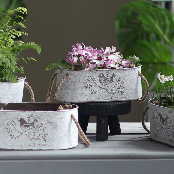 Decorative storage basket made of metal with natural design Bowlift