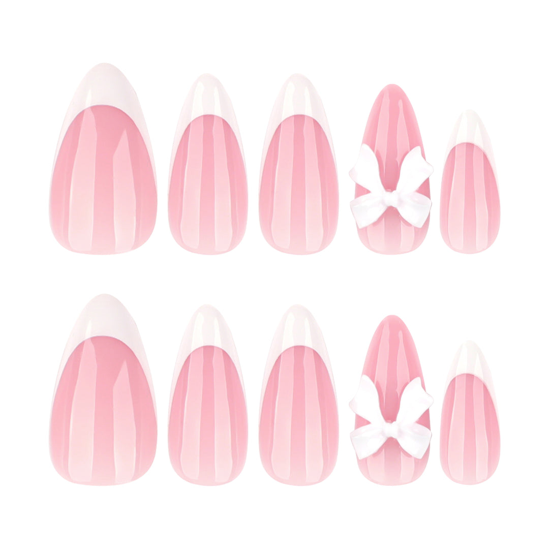 Artful nail designs with elegant tips and delicate bow motifs Bowlift