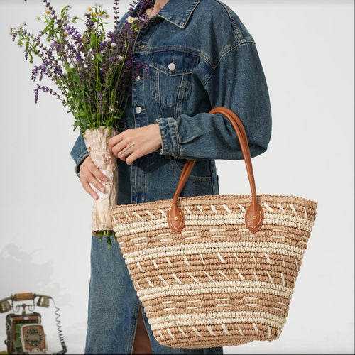Handbag made of woven natural material with stylish leather handles Bowlift