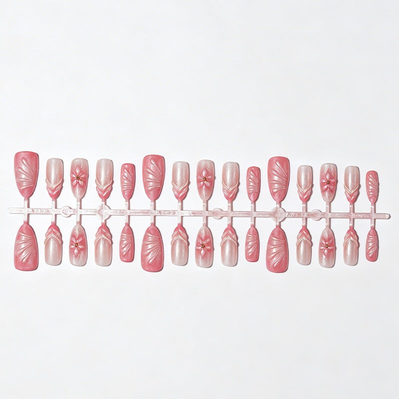 Artificial nail set with filigree flowers and glitter accents Bowlift