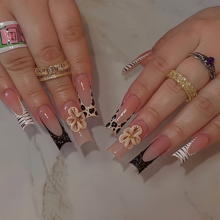 Artistic Press-On Nail Art Tips with Floral and Animal Print Designs Bowlift