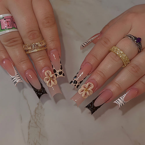 Artistic Press-On Nail Art Tips with Floral and Animal Print Designs Bowlift