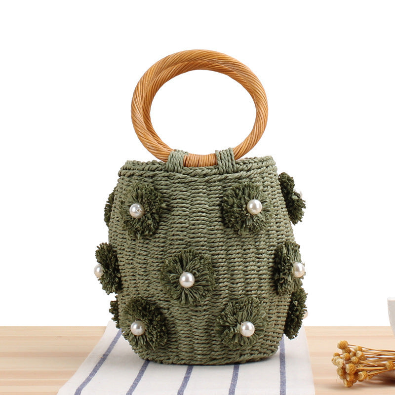 Handcrafted basket bag with bead appliqués Bowlift