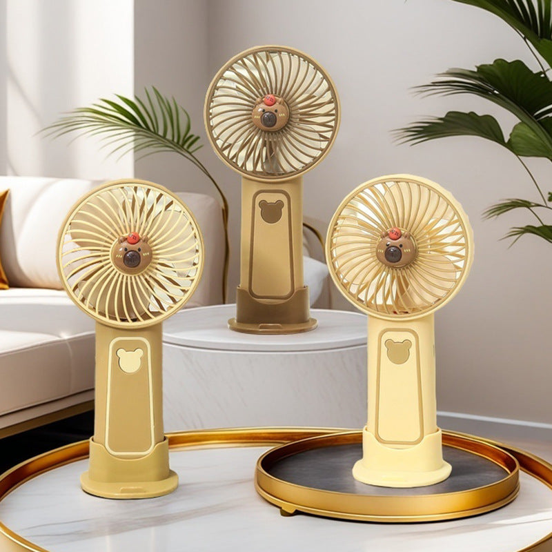 Unisex portable rechargeable hand fan with integrated stand and cute bear design Bowlift