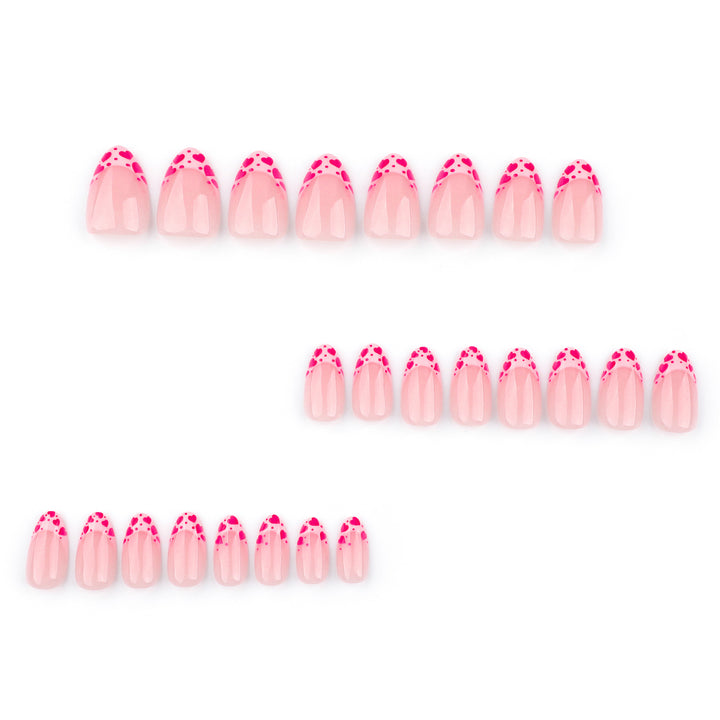 Artificial nail extensions with heart tip accents Bowlift