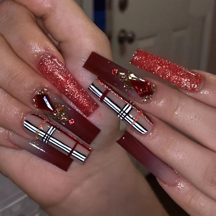 Glamorous stiletto nails with extravagant design and glitter accents Bowlift