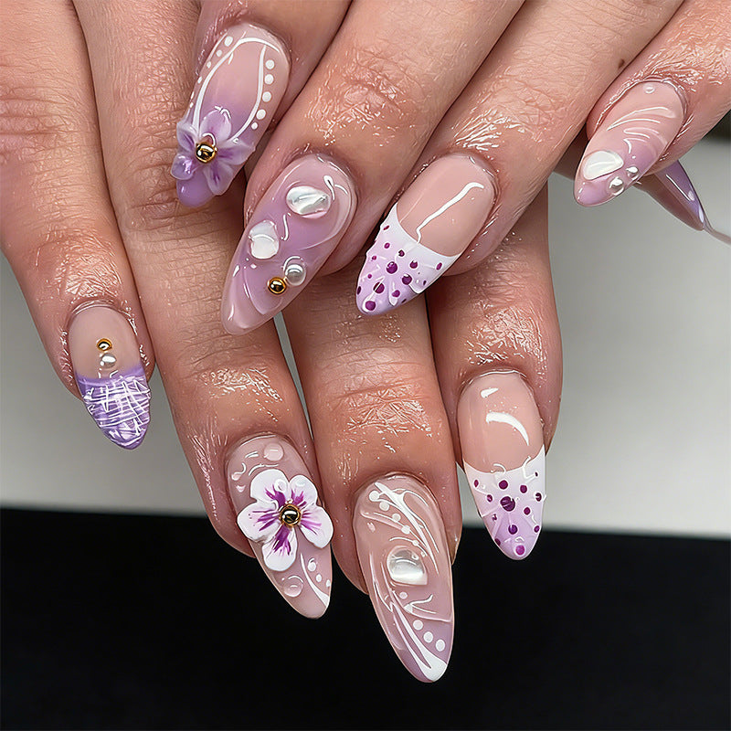 Artificial nail set with exotic floral and glitter accents Bowlift