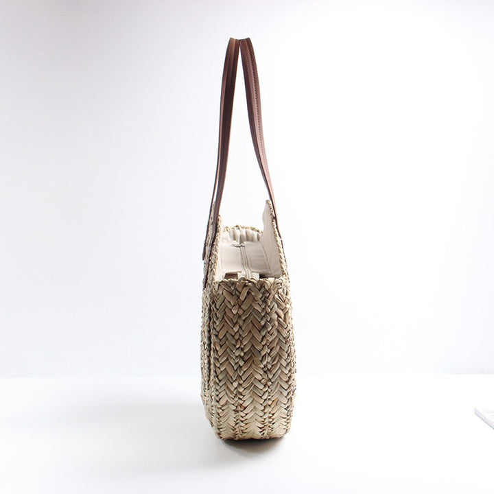 Braided straw beach bag with elegant leather handles Bowlift