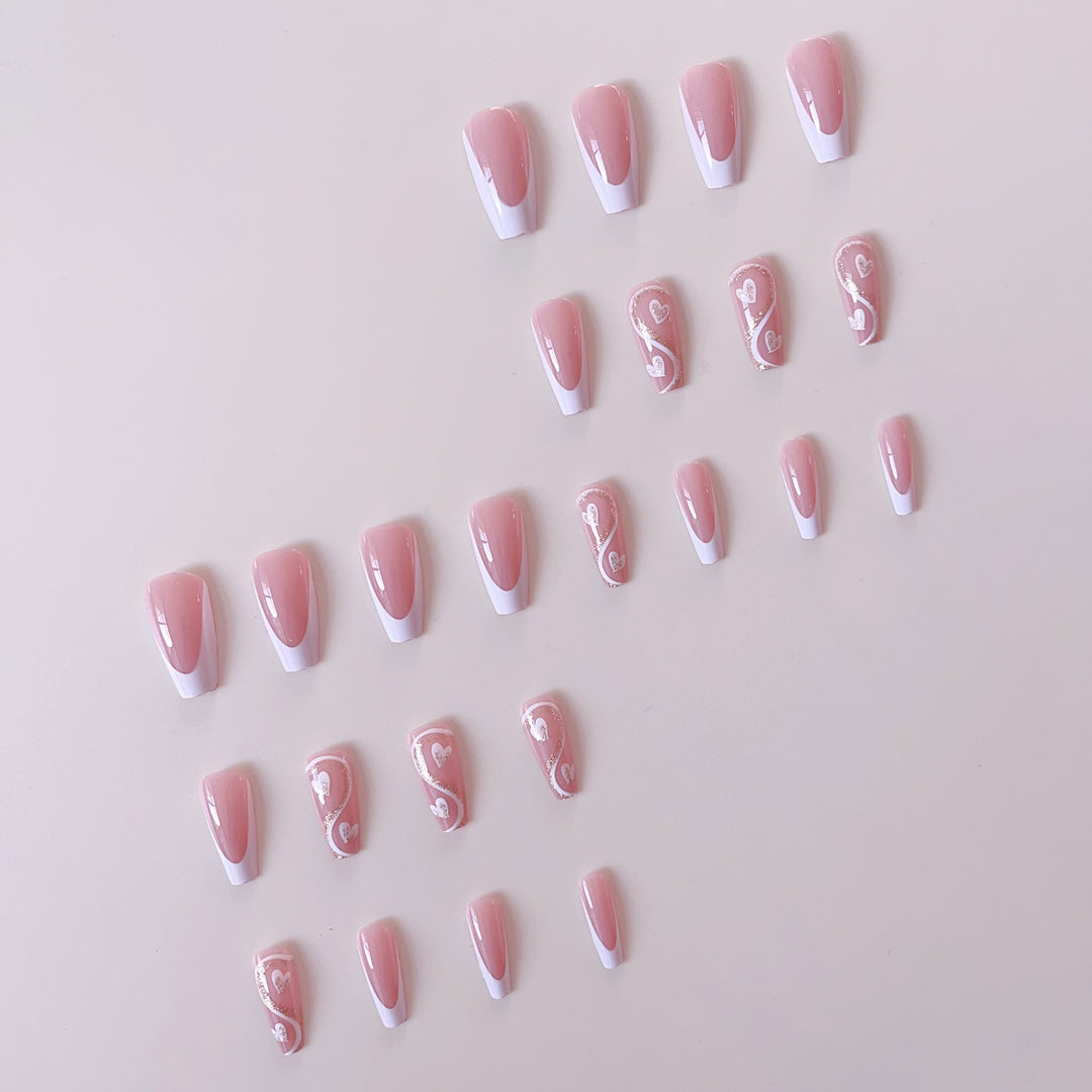 Artificial nail set with elegant heart decorations and glitter accents Bowlift