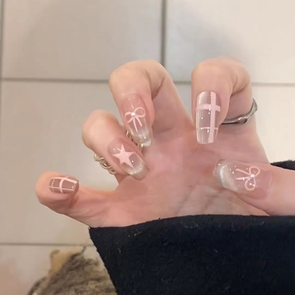 Artistic acrylic nails with elegant bow and star designs Bowlift
