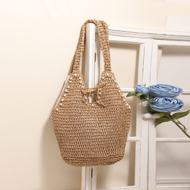 Handbag with pearl decor and innovative closure Bowlift
