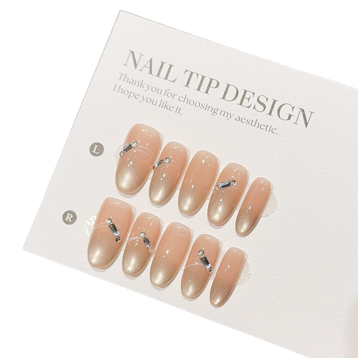 Artificial nail tips with elegant gradient color and rhinestone accents Bowlift