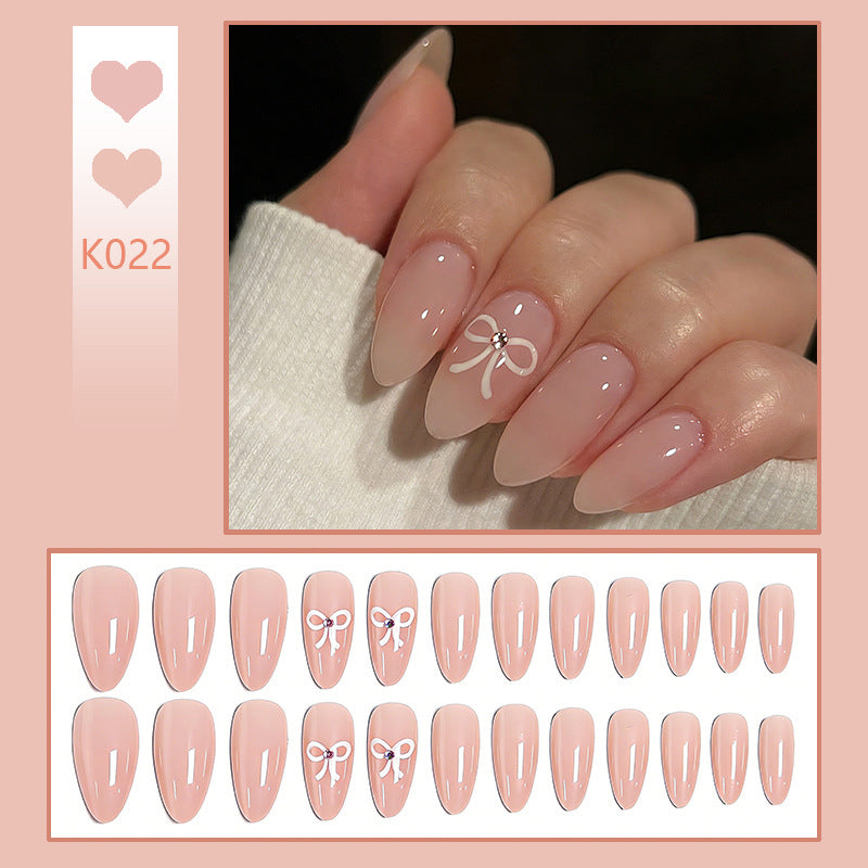 Artificia nails with delicate bow accents Bowlift