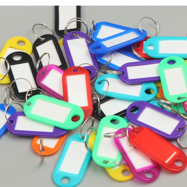 Unisex writable keychain with clear labeling field Bowlift