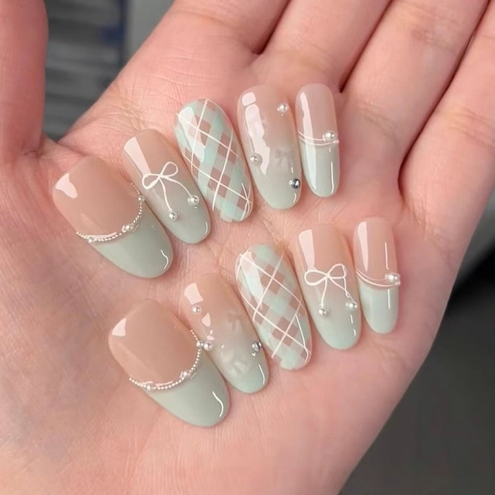 Artistic Press-On Nail Set with Floral and Heart Designs Bowlift