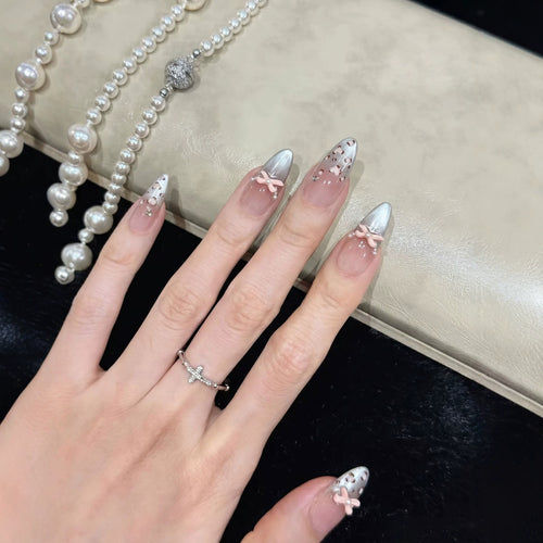Decorative Press-On Nail Design with Bow Accents Bowlift